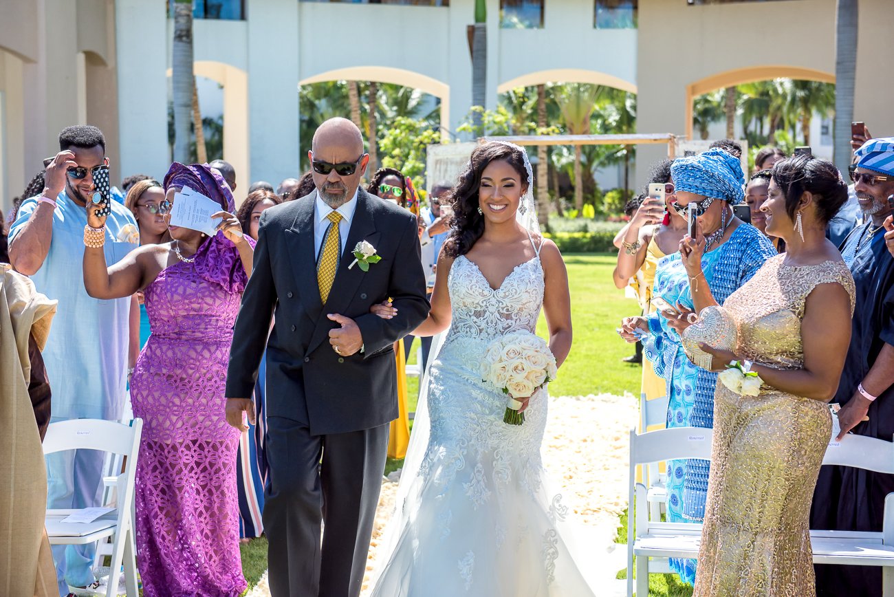 Bride walking down the aisle with her father at Hard Rock Hotel Dominican Republic wedding, captured by Alito Photography.