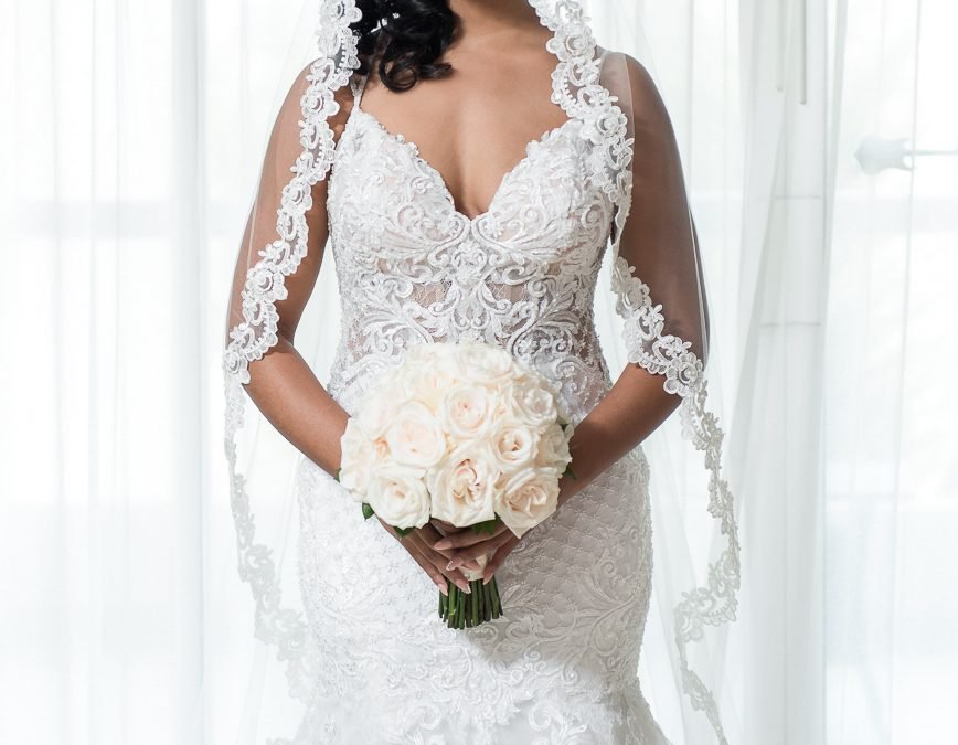 Bride holding a bouquet before her destination wedding ceremony at the Hard Rock Hotel in Punta Cana, photographed by Alito Photography.