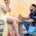 Surprise engagement proposal in Miami, groom on one knee with engagement ring as bride reacts emotionally during engagement session, captured by Alito Photography.