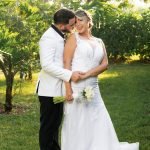 Wedding couple walking through the gardens of a Redland venue in Miami, captured by Alito Photography with a Nikon Z8 and 85mm lens, telling their unique love story.
