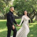 Miami wedding photographer captures a bride leading her groom by the hand in a romantic garden moment.
