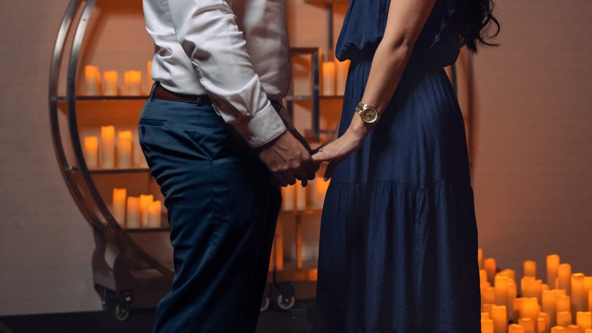 Surprise engagement proposal during a candlelight concert at Jungle Island in Miami, captured by Alito Photography, a Miami engagement and wedding photographer.