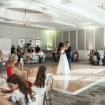 Bride and groom first dance at The Club at Ibis West Palm Beach with family watching – luxury wedding photography by Alito Photography