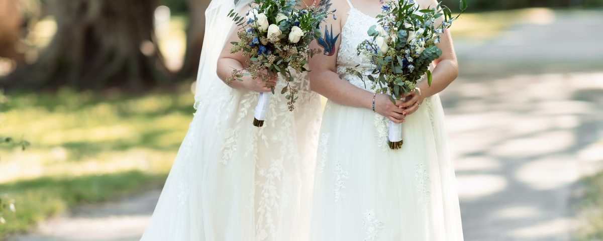 Same-sex wedding couple sharing a romantic moment during their wedding day, photographed by Miami wedding photographer Alito.