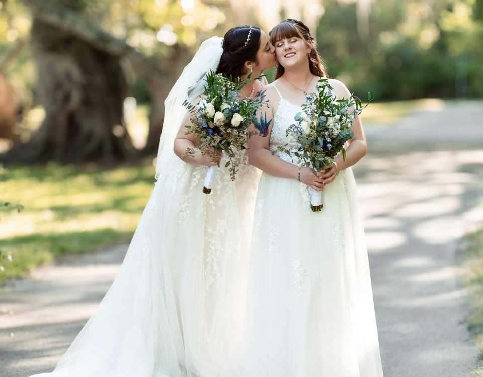 Same-sex wedding couple sharing a romantic moment during their wedding day, photographed by Miami wedding photographer Alito.