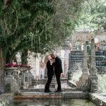 LGBTQ couple wedding portraits at Vizcaya Museum and Gardens captured by Alito Photography, featuring romantic poses among historic gardens and European-style architecture.